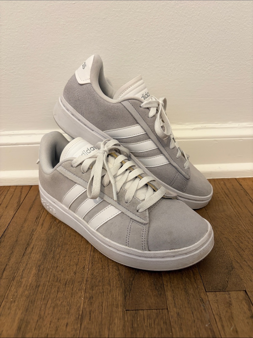 adidas Womenโs Light Gray Suede Sneakers with White 3-Stripes